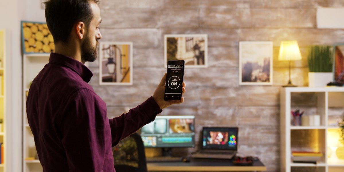 Using a smart light application to turn on the light bulbs in the house